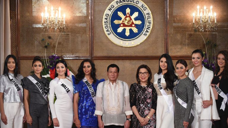 Miss Universe contestants pose for photos with Philippine President Rodrigo Duterte 