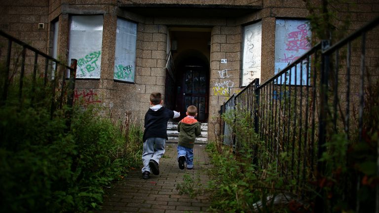 Two young boys play football in the street, September 30, 2008 in the Govan area of Glasgow, Scotland