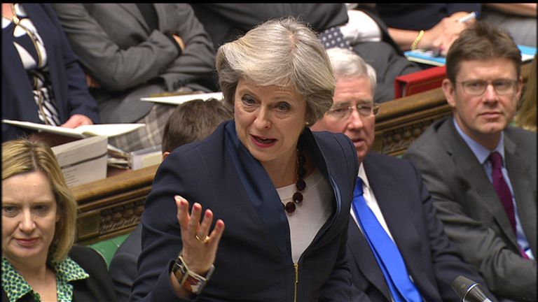 Theresa May answers questions from MPs in the Commons