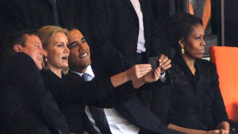 US President Barack Obama (R) and British Prime Minister David Cameron pose for a selfie picture with Denmark&#39;s Prime Minister Helle Thorning Schmidt (C) next to US First Lady Michelle Obama (R) during the memorial service of South African former president Nelson Mandela at the FNB Stadium (Soccer City) in Johannesburg on December 10, 2013