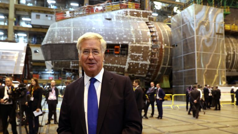 Defence Secretary Michael Fallon speaks to media in front of HMS Audacious at BAE Systems, Burrow-in-Furness, where he will attend a steel-cutting ceremony to formally commence production of the UK&#39;s next generation of nuclear submarines
