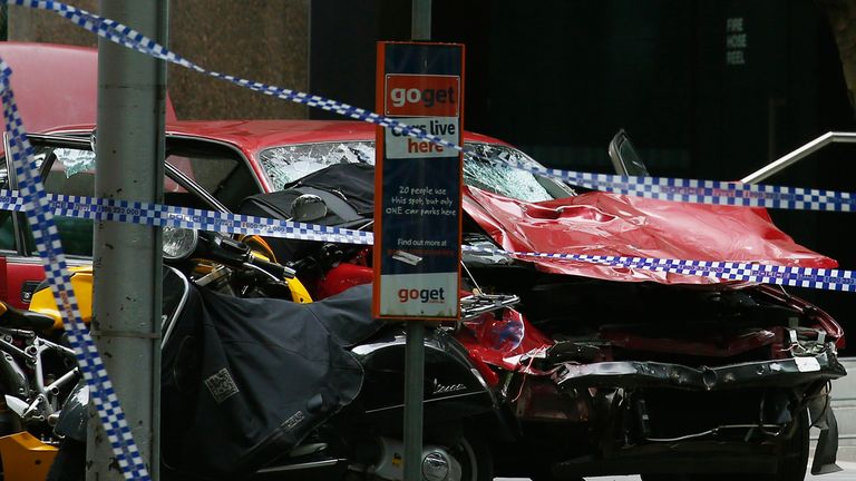 The wreckage of a car is seen as police cordoned off Bourke Street mall, after a car hit pedestrians in central Melbourne, Australia, January 20, 2017