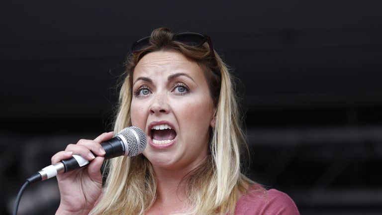 Welsh singer Charlotte Church speaks to protesters following a march against the British government&#39;s spending cuts 
