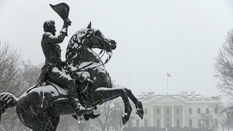 A statue of General Andrew Jackson stands outside the White House