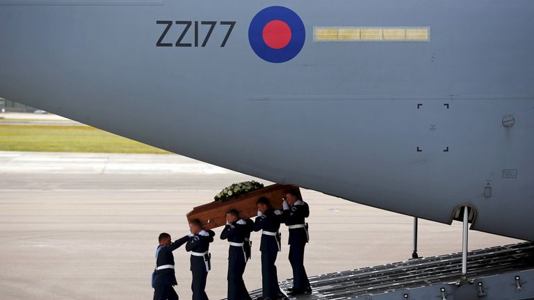 The coffin of victim Christopher Bell pictured during repatriation to Britain