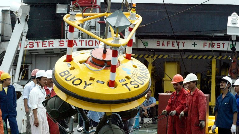 A tsunami early warning buoy being installed in Banten province, Indonesia, in 2007
