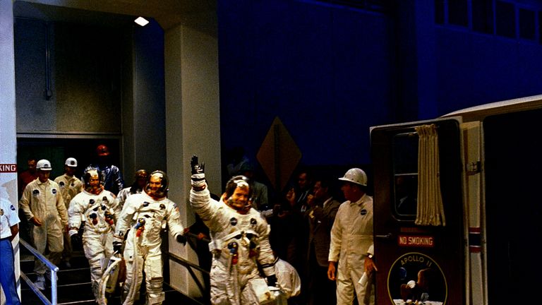 Astronauts Neil Armstrong, Michael Collins and Buzz Aldrin ride the special transport van over to Launch Complex 39A where their spacecraft awaited them