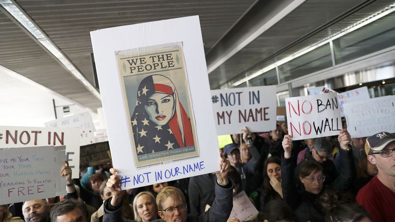 SAN FRANCISCO, CA - JANUARY 28: Demonstrators hold signs during a rally against a ban on Muslim immigration at San Francisco International Airport on January 28, 2017 in San Francisco, California. President Donald Trump signed an executive order Friday that suspends entry of all refugees for 120 days, indefinitely suspends the entries of all Syrian refugees, as well as barring entries from seven predominantly Muslim countries from entering for 90 days. (Photo by Stephen Lam/Getty Images)