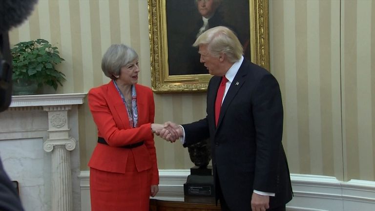 Theresa May shakes hands with Donald Trump with Winston Churchill bust in background
