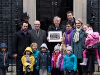 Lord Dubs and a group of child refugees delivered a petition to Downing St