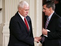 Mike Pence (L) went on TV to defend Michael Flynn