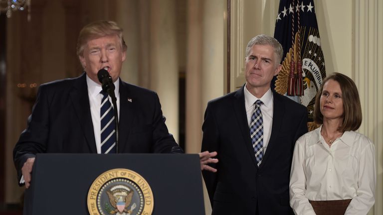 Judge Neil Gorsuch (C) and his wife Marie Louise look on, after US President Donald Trump nominated him for the Supreme Court, at the White House in Washington, DC, on January 31, 2017. Trump named Judge Neil Gorsuch as his Supreme Court nominee