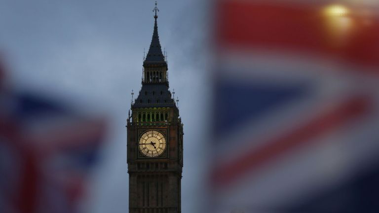 Union flags fly near the The Elizabeth Tower, commonly known Big Ben, and the Houses of Parliament in London on February 1, 2017
