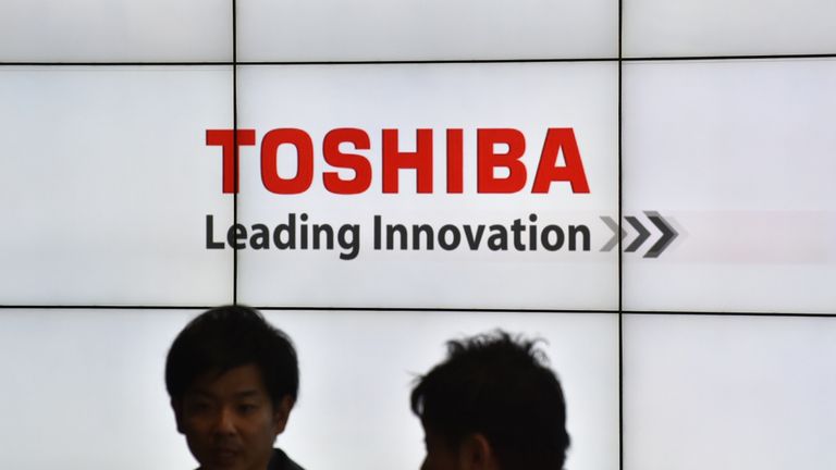 The logo of Japan&#39;s Toshiba Corp. is displayed at the company&#39;s headquarters in Tokyo on January 27, 2017. Toshiba said on January 27 it will spin off its memory chip business, following reports that the vast conglomerate is planning to sell a stake in the unit to repair its battered balance sheet