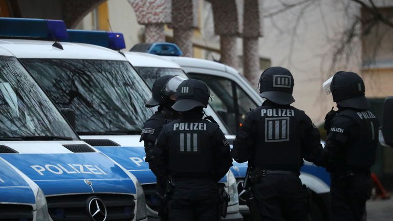 Police stand guard outside the Bilal mosque in Frankfurt
