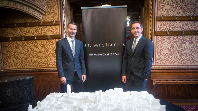 Giggs and Neville with a model of the development