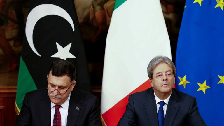 Fayez al-Sarraj and his Italian counterpart Paolo Gentiloni sign a bilateral agreement