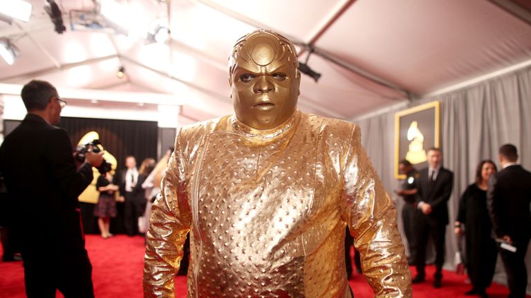 CeeLo Green showed up in a metallic gold outfit...