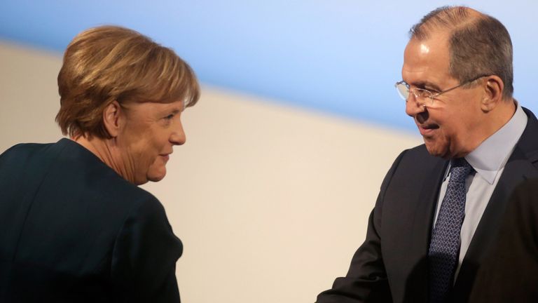 Angela Merkel shakes hands with Sergei Lavrov