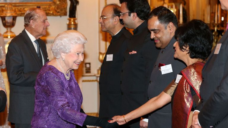 Queen Elizabeth II greets Yashvardhan Kumar Sinha and his wife, at a reception to mark the launch of the UK-India Year of Culture 2017 at Buckingham Palace, London
