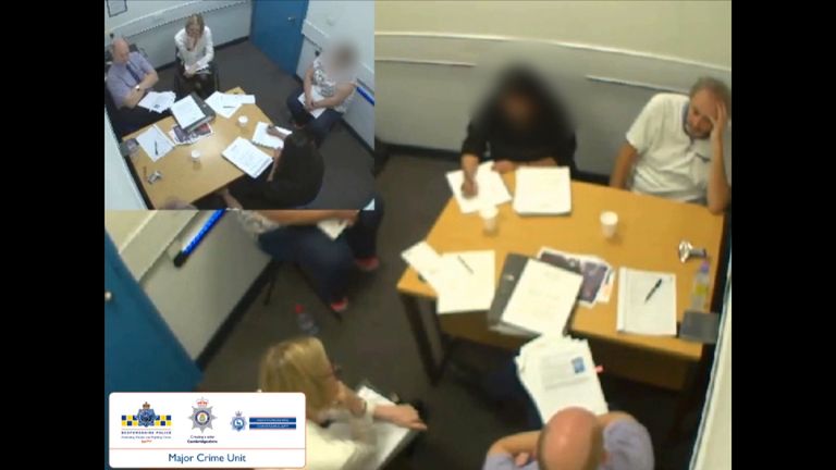 Ian stewart being questioned in an interview room by officers