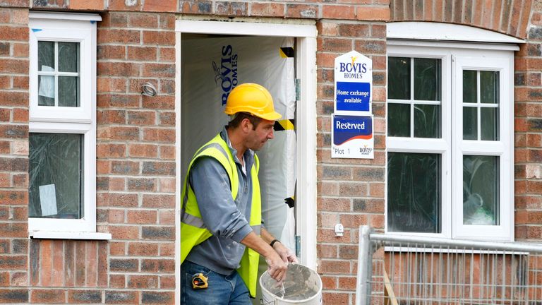 A builder works at a Bovis homes housing development near Bolton, Britain, July 9, 2008. 