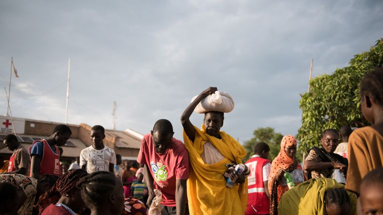 Refugee wait to be registered as displaced at a Red Cross centre in South Sudan