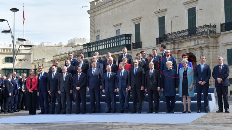 Mrs May stands next to Dalia Grybauskaite in the &#39;family&#39; photo of EU leaders at the summit in Malta