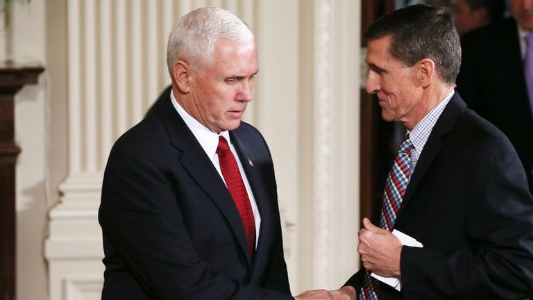Mike Pence (L) went on TV to defend Michael Flynn