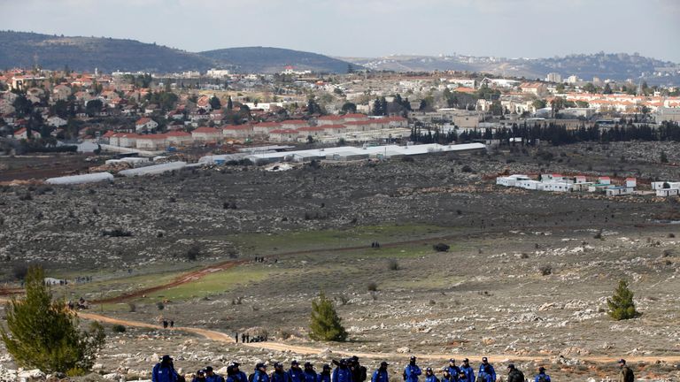 Israeli security forces gather to evict the hardline occupants of the wildcat settlement outpost 