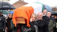 Michelle O'Neill and Gerry Adams carry Martin McGuinness' coffin