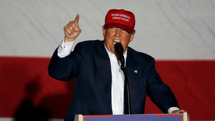 Trump swaps trademark red cap for 'great looking' navy hat