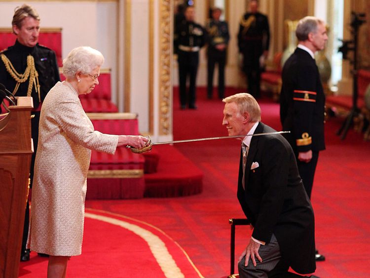 Veteran entertainer Sir Bruce Forsyth is knighted by Queen Elizabeth II at Buckingham Palace, London, 2011