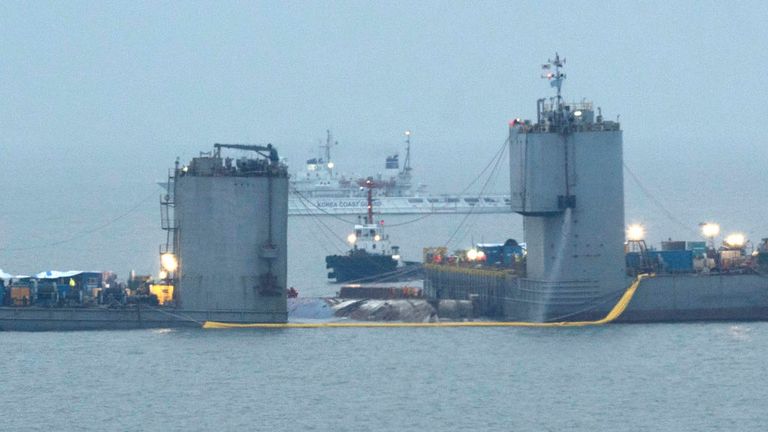 Barges continue to salvage the sunken Sewol ferry in South Korea