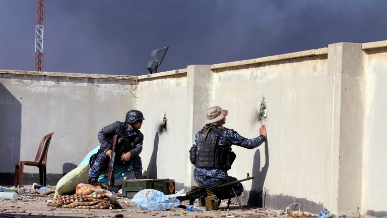 Iraqi troops take up positions during the battle against IS in Mosul