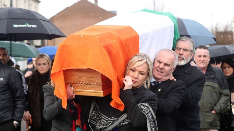 Michelle O'Neill and Gerry Adams carry Martin McGuinness' coffin