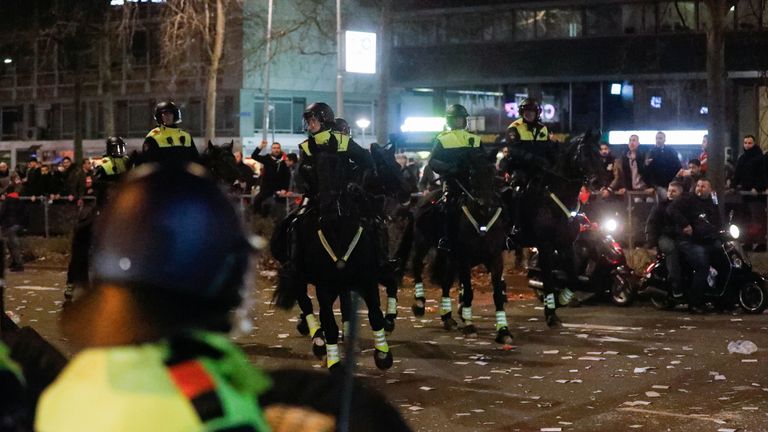 Riot police use horses to remove demonstrators outside the Turkish consulate in Rotterdam, Netherlands March 12, 2017. REUTERS/Yves Herman