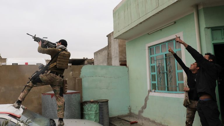 An Iraqi special forces soldier fires at an Islamic State drone