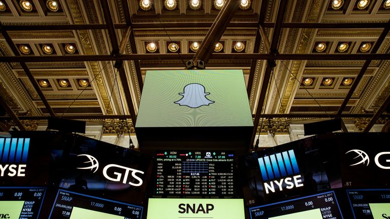 Signage for Snap Inc., parent company of Snapchat, is displayed on monitors on the floor New York Stock Exchange (NYSE) before the opening bell, March 2, 2017 in New York City. Snap Inc. priced its initial public offering at $17 a share on Wednesday and Snap shares will start trading on the New York Stock Exchange on Thursday