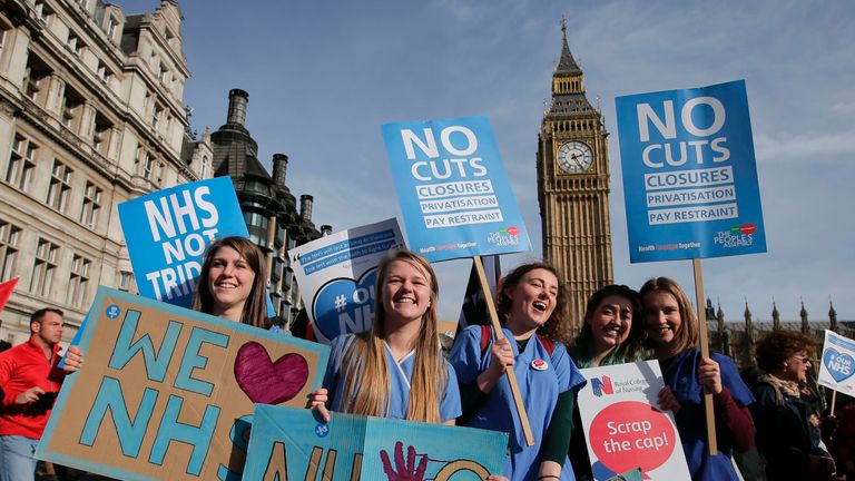 Protesters gather in Westminster during a demonstration in support of the NHS