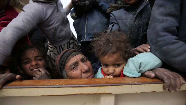 Civilians from west Mosul arrive at a camp for displaced people
