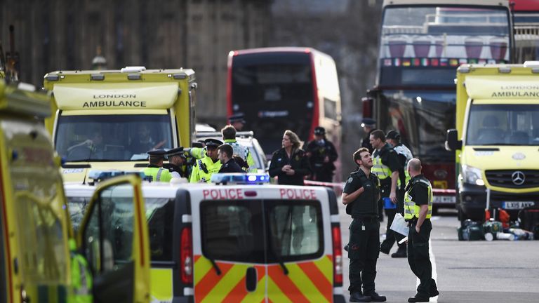 Police and ambulance crews at the scene in Westminster, London, following a terror attack in which several people have been killed and many more injured