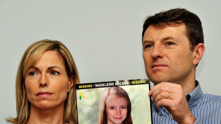 Kate and Gerry hold a photo of what Madeleine may look like at nine years old