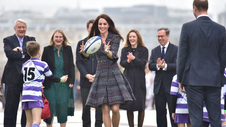 The Duke and Duchess of Cambridge at the Trocadero, join in a game of rugby with school children