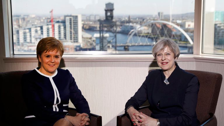 Nicola Sturgeon (L) and Theresa May