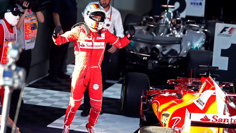 Ferrari driver Sebastian Vettel of Germany celebrates after winning the Australian Grand Prix