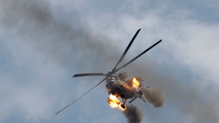 An Iraqi Air Force helicopter fires missiles against Islamic State militants 