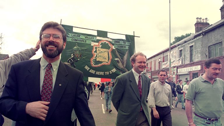 Gerry Adams and Martin McGuinness lead a Republican parade in Belfast, commemorating 25 years of British troops on the streets of Northern Ireland, 1994