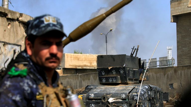 Smoke rises from clashes between Iraqi forces and IS militants
