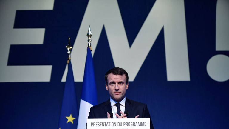 Emmanuel Macron gives a speech as he unveils his full programme eight weeks from election day
